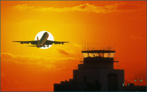 Air traffic control tower at sunset