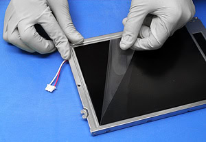 Photo of applying film to a display