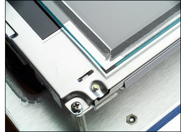 Protective glass overlay adhered to the LCD