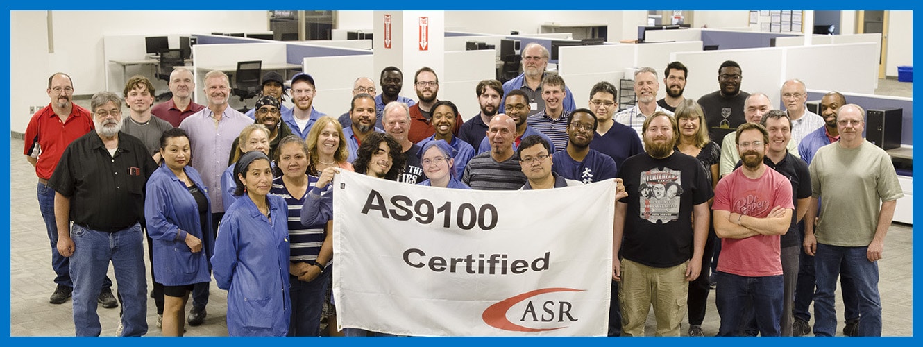Photo of General Digital employees with AS9100D banner