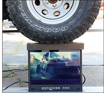 Photo of Jeep supported by two monitors